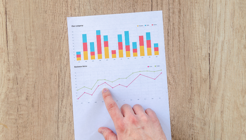 social media influencer analyzing data on computer with graphs and charts